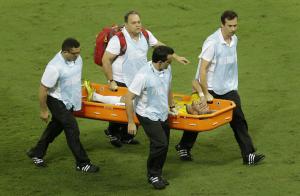 Neymar is carried off the field after a challenge which resulted in a fractured vertebra. Photo Credit: AP