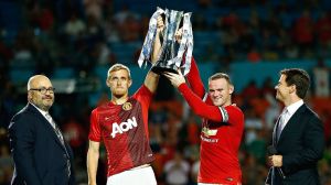 Darren Fletcher & Wayne Rooney celebrate with the 2014 ICC trophy Monday night. Photo Credit: ESPN
